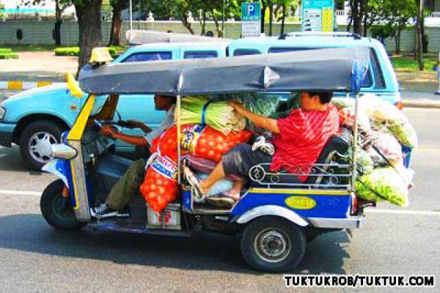Tuk Tuk passenger with vegetable